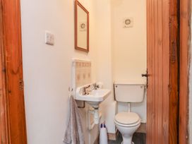 A bathroom with sink and toilet at Bryn Bach in Pentraeth