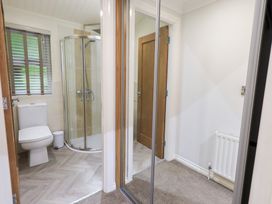 A bathroom with a shower and toilet at Laughing Duck in Troutbeck Bridge