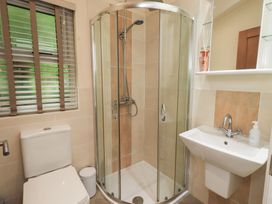 A bathroom with a shower, toilet and sink at Laughing Duck in Troutbeck Bridge