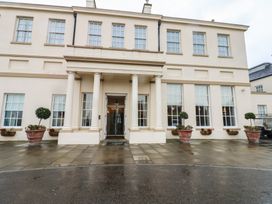 A building entrance with columns and planters at Costal Lodge at Seaham Hall Seaham