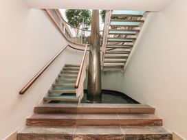 A staircase with handrail and plants at Costal Lodge at Seaham Hall Seaham