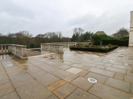 An outdoor area with a stone patio and garden features at Costal Lodge at Seaham Hall Seaham