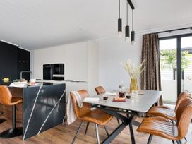 A kitchen with a table and chairs at Costal Lodge at Seaham Hall Seaham