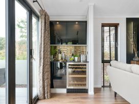 A kitchen with a bar area and glassware at Costal Lodge at Seaham Hall, Seaham
