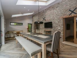 A dining room with a table and chairs at 3 bed property