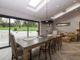 A dining room with a table and chairs at 3 bed property