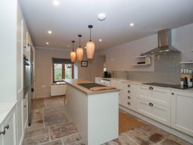 A kitchen with an island and appliances at 3 bed property