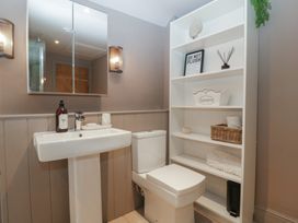 A bathroom with sink and toilet at 3 bed property