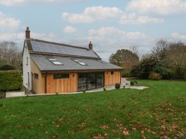 A house with solar panels and garden at a 3 bed property