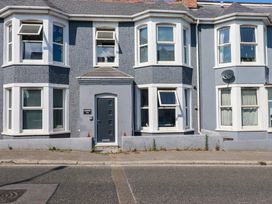 A house with multiple windows and a front door at Higher Tower Road 