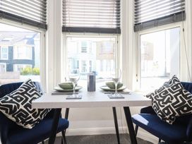 A dining room with a table set for two at Higher Tower Road