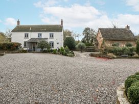 A house with a gravel driveway and garden at 1 bed property in Usk