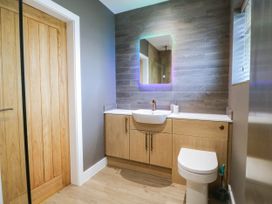 A bathroom with a sink and toilet at Angorfa in Pentraeth