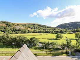A rural landscape with trees and a river at Haulfryn in Dolwyddelan