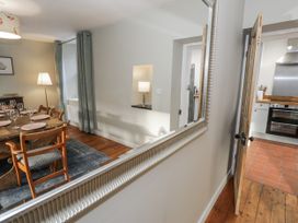A dining room with a table and chairs at Haulfryn in Dolwyddelan