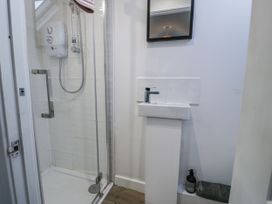 A bathroom with a shower and sink at Haulfryn in Dolwyddelan