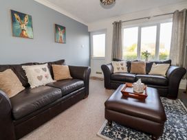 A living room with two sofas and a table at Forget Me Not Cottage in Hull