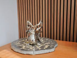 A sculpture of an octopus on a display stand at Arum in Portland Bill