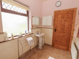 A bathroom featuring a sink and towel rack at Coole Gate Lodge in Gort, County Galway