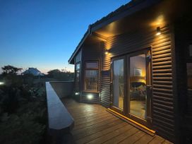 An exterior view of a house with a deck at Lamorna Sennen