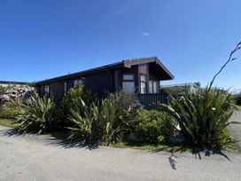 A house surrounded by plants and a pathway at Lamorna, Sennen