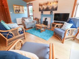 A living room with a sofa and coffee table at Lamorna in Sennen