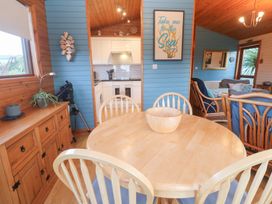 A dining room featuring a table and chairs at Lamorna in Sennen