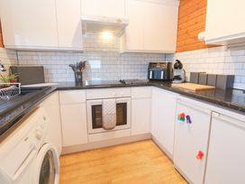 A kitchen with appliances and utensils at Lamorna in Sennen