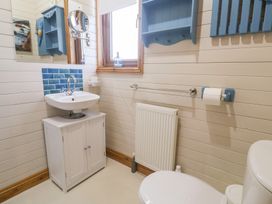 A bathroom with a sink and toilet at Lamorna in Sennen