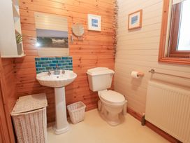 A bathroom with a sink and toilet at Lamorna in Sennen