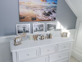 A dresser with photographs and decorative items at Woodlawn Retreat, Portanure near Lough Gowna