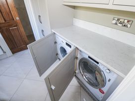A laundry room with washing machine and dryer at Woodlawn Retreat in Portanure near Lough Gowna