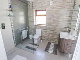 A bathroom with a shower and sink at Woodlawn Retreat Portanure near Lough Gowna