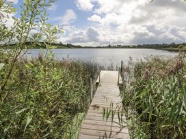 A wooden dock extending into the water at Woodlawn Retreat in Portanure near Lough Gowna