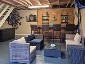 A garage with seating area and bar at Woodlawn Retreat Portanure near Lough Gowna