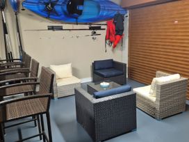 A garage with seating and fishing equipment at Woodlawn Retreat in Portanure near Lough Gowna