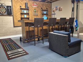 A game room with a bar and seating area at Woodlawn Retreat in Portanure near Lough Gowna