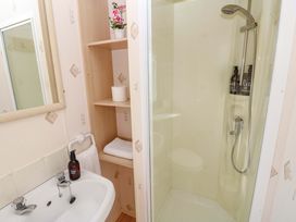A bathroom with a sink and shower at Number 38 in Chichester