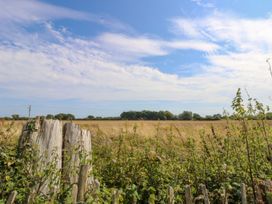 A field with grass and trees at Number 38 in Chichester