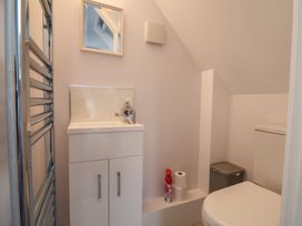 A bathroom with a sink and toilet at Cherry Pip in Charmouth
