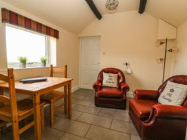 A dining room with a table and chairs at 1 Small in Malton