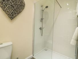 A bathroom with a shower and toilet at 1 Small in Malton