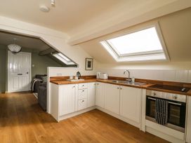 A kitchen with wooden countertop and skylight at 2 Jade side in Malton