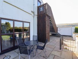 An outdoor area with a table and chairs at West Cottage East Knapton near Rillington