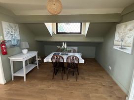 A dining room with a table and chairs at West Cottage in East Knapton near Rillington