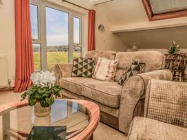 A living room with a sofa and coffee table at 3 Marinas side in Malton