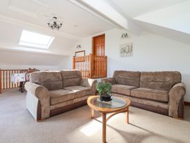 A living room with sofas and a table at West Cottage in East Knapton near Rillington