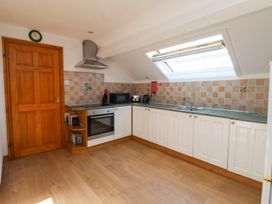A kitchen with cabinets and appliances at West Cottage East Knapton near Rillington