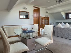 A living room with a dining table and chairs at East Cottage East Knapton near Rillington