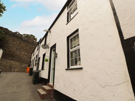 An exterior view of a house with windows and a door at 8 Watkin Street in Conwy